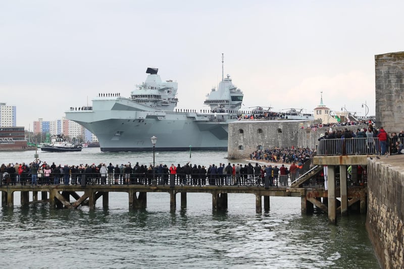 The Royal Navy aircraft carrier HMS Queen Elizabeth passes the Round Tower as it leaves Portsmouth. Picture: Andrew Matthews/PA Wire