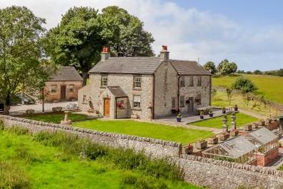 This idyllic Georgian farmhouse With a large garden area and three-acre field also comes with two detached annexes, ideal for holiday lets. It is on the market for £1.2 million with Bagshaws Residential.