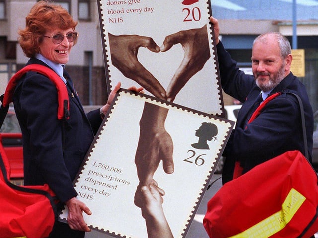 Postie Judith Rosser and Barry Oxborrow showing off the new Royal Mail stamps in 1998