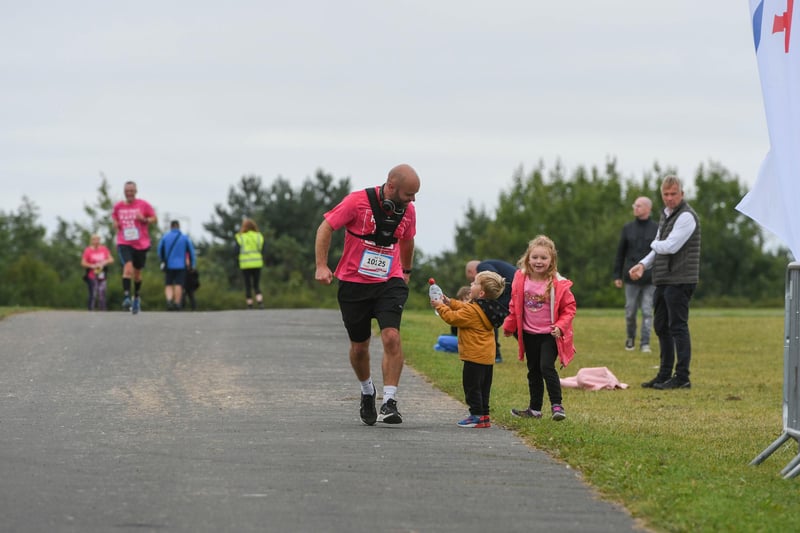 2nd palced runner Matthew Sykes being offered refreshment from his family at The Race for Life at Herrington Country Park, on Sunday.