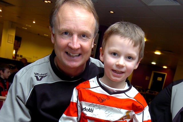 Sean O'Driscoll meets six-year-old Jude Kirk of Bentley at the Junior Rovers Christmas party in 2009
