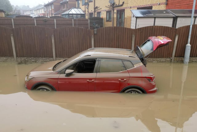 ROTHERHAM, UNITED KINGDOM - OCTOBER 23: In this aerial view, water damaged cars are seen as flood waters begin to recede in the village of Catcliffe after Storm Babet flooded homes, business and roads on October 23, 2023 in Rotherham, United Kingdom. The UK Environment Agency has warned that flooding could last for days in the wake of Storm Babet with 116 flood warnings remaining in place across England. (Photo by Christopher Furlong/Getty Images)