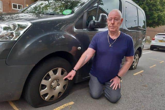 David Bowns shows the damage to his car, which he says was slashed in a spate of vandalism on his street in Crookes.