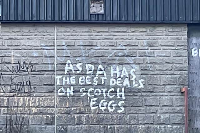 A graffiti tag in Sheffield has claimed Asda does the "best deals" on scotch eggs. Image: Twitter/@GeorgeCritchley