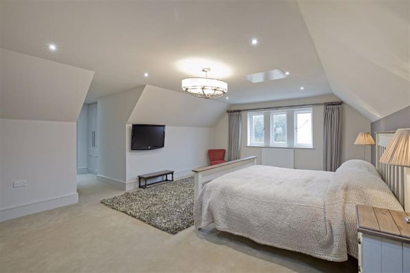 Bedroom suite with double bedroom, walk-in dressing area and luxury, ensuite shower room.
