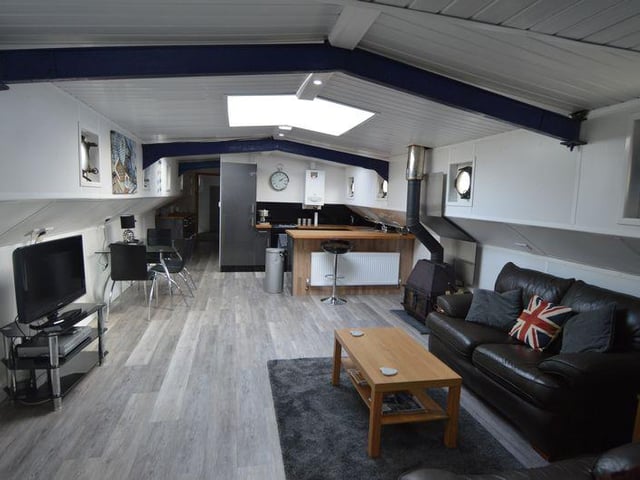 This three-bed houseboat in Bursledon is on the market for £169,950.