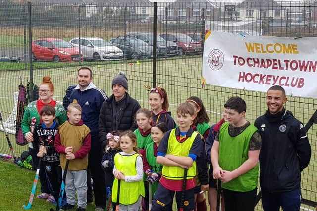 Matt Bradshaw (back left) and next to him Team GB Hockey star Tom Sorsby along with junior members of Chapeltown Hockey Club and Ross (far right).