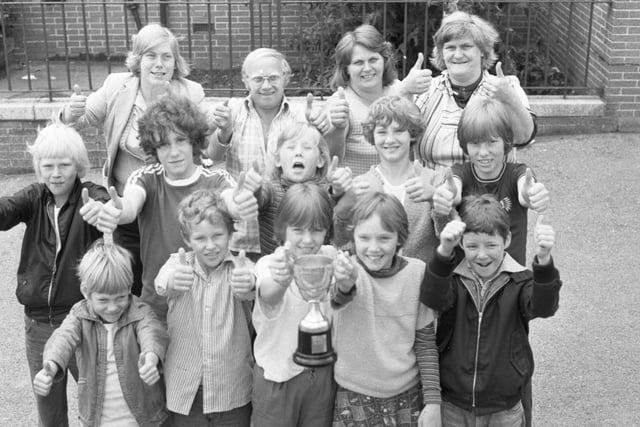 Proudly showing off their trophy are members and leaders from Ford and Hylton Playscheme who carried off the top prize in the Sunderland Carnival "It's a Knockout" in 1979.