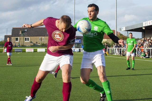 Former Hibs captain Ian Murray involved in the action