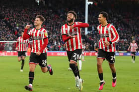 Iliman Ndiaye (right) is well respected by Sheffield United players such as Jayden Bogle (centre) and James McAtee: Lexy Ilsley / Sportimage