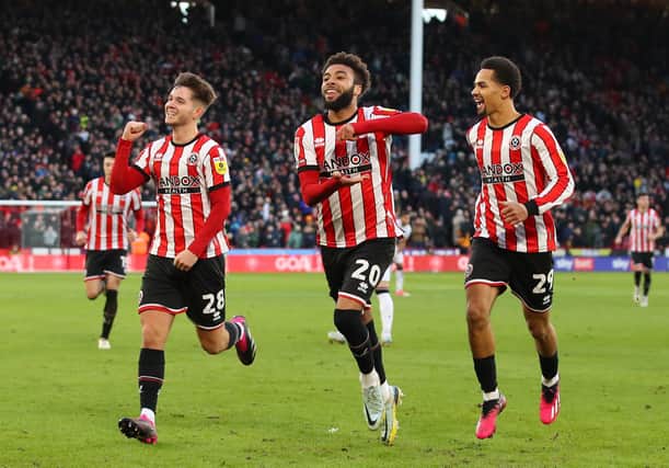 Iliman Ndiaye (right) is well respected by Sheffield United players such as Jayden Bogle (centre) and James McAtee: Lexy Ilsley / Sportimage