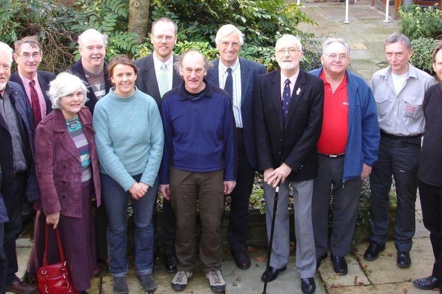 Hucklow and Foolow members of the Silence Heritage Trust with  Peak District National Park officials at the official handover of the site in 2008
Trust chair Derek Lee is 4th right, national park services committee chair Andrew Marchington far right, and Vision for Wildlife officer Rebekah Newman front row, 2nd left.
