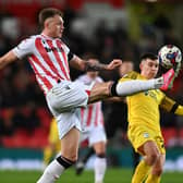 Harry Souttar of Stoke City battles for the ball with Ben Woodburn of Preston during the Sky Bet Championship between Stoke City and Preston North End at Bet365 Stadium on January 02, 2023 in Stoke on Trent, England. (Photo by Gareth Copley/Getty Images)