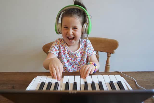Young patients and their families are being provided with keyboards and ukuleles