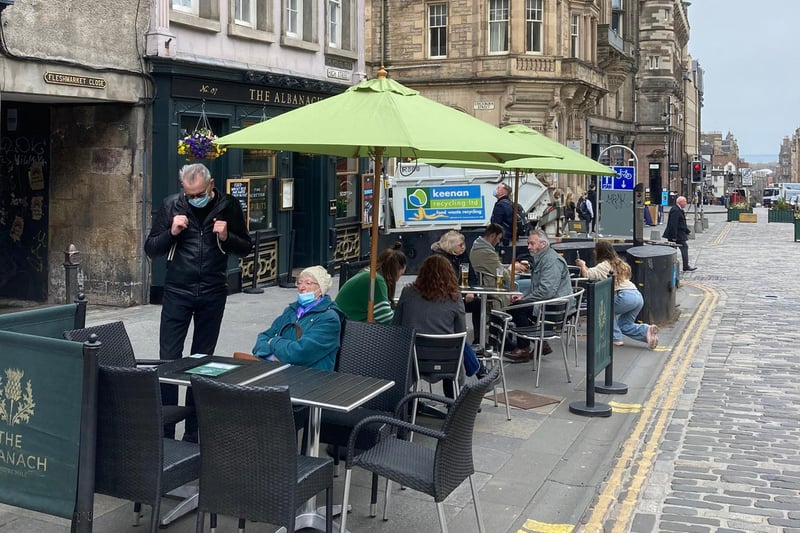 A pint in a beer garden or at a table in an outdoor eating area is now allowed, after months of strict lockdown restrictions. Here are some people taking a seat at Albanach in High Street, Edinburgh.