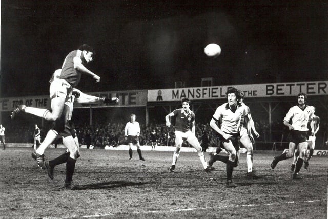 Moss rises above the Shrewsbury defence to power home a header in the 1978/79 season.