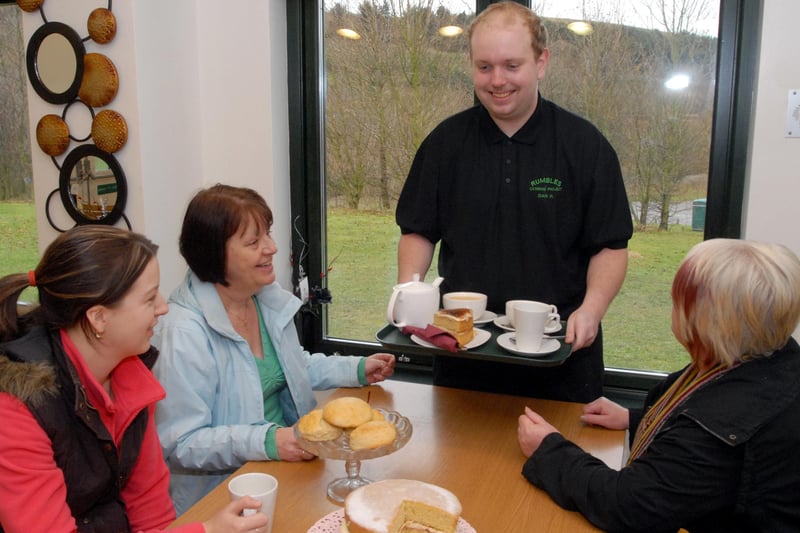 Student Daniel Hucknall serves coffee and cake at Rumbles Café in Clipstone.