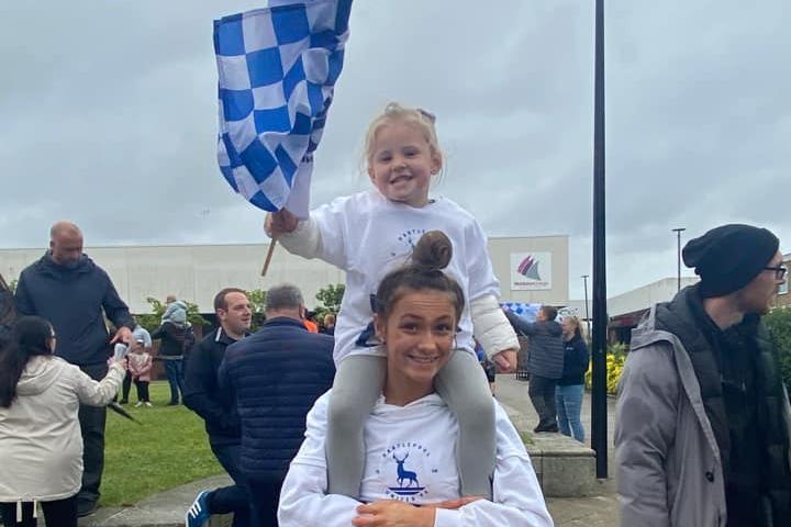 Fans of all ages turned out to cheer on the team at their promotion parade.