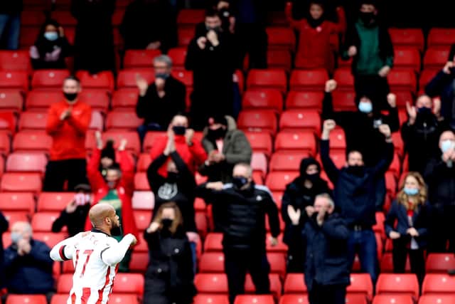 David McGoldrick of Sheffield United celebrates after scoring their side's first goal in front of the fans during the Premier League match between Sheffield United and Burnley.