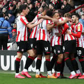 Josh Dasilva celebrates one of his two goals for Brentford in their 5-0 win over Sheffield Wednesday on Saturday.