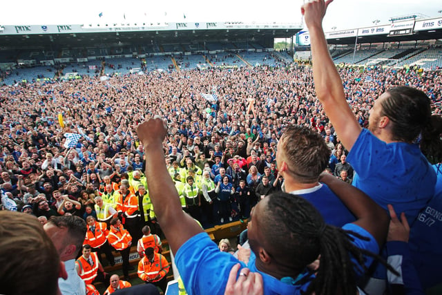 Pompey look out to the fans to celebrate.