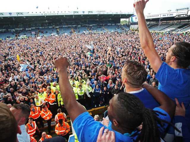 Pompey look out to the fans to celebrate.