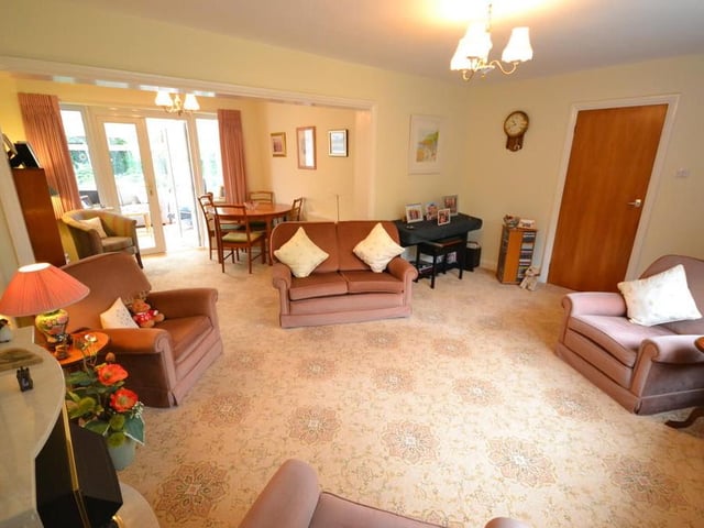 Lounge - A good sized living room with open plan access to the dining room, having a pleasant view of the front garden from a UPVC double glazed bow window, feature coal effect electric fire with marble surround, various power sockets, tv aerial point and a large central heating radiator.