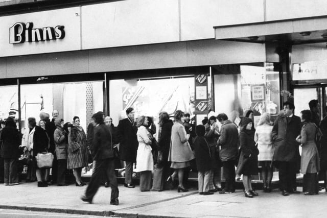 Gale force winds did not deter shoppers from queuing as post-Christmas sales started at Binns in 1975, but are you pictured?
