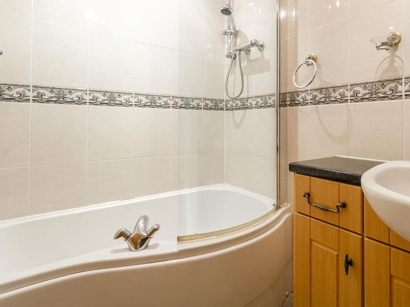 Complete with panelled bath, low-flush WC and wash hand basin.