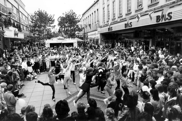 Young dancers entertain the crowds during a busy Moor the Merrier Week, Sheffield, in 1987