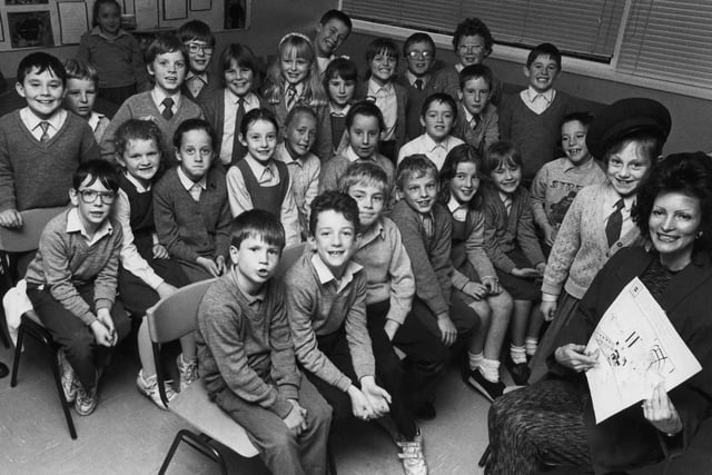 Children of St Aloysius Junior School are pictured watching a presentation in 1990. Are you in the photo?