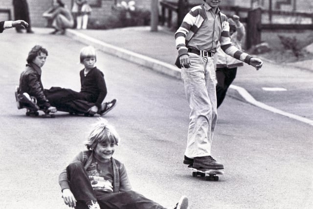 The Skate Board Kids... Sitting down or standing up, it's all the same for these youngsters performing on their skate boards in Scraithwood Drive, Sheffield - 8th August 1977