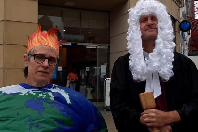Janice Jones and Richard Teasdale at a climate change street theatre protest outside Barclay's Bank in Sheffield city centre