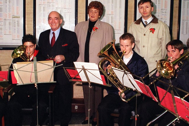 At the switch on of the Christmas Tree lights at Doncaster station members of the senior brass ensemble from the William Appleby Music Centre played carols before the lights were switched on by at rear from left Lord Walker and Dorothy SEdgwick executive member of the St Johns Hospice with right Paul Stubbs conductor back in 1999