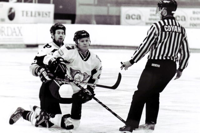 Ted Russell, the cornerstone of another great and hugely successful Fife Flyers team - pictured on the ice with Jesse Hammill (Peterborough Pirates), and linesman Rab Cowan in November 2000