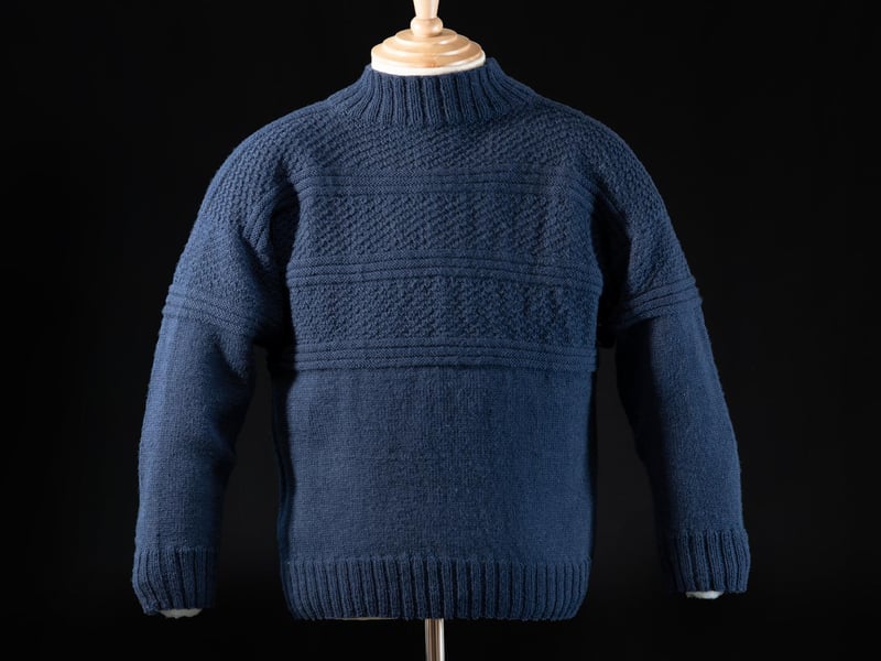 This warm and largely waterproof style of jumper was popular among fishermen. Created with extraordinary skill, families and communities developed their own patterns and it is said that if a fisherman was washed overboard, he could be identified by the pattern of his gansey.