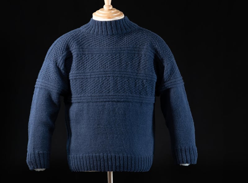 This warm and largely waterproof style of  jumper was popular among fishermen. Created with extraordinary skill, families and communities developed their own patterns and it is said that if a fisherman was washed overboard, he could be identified by the pattern of his gansey.