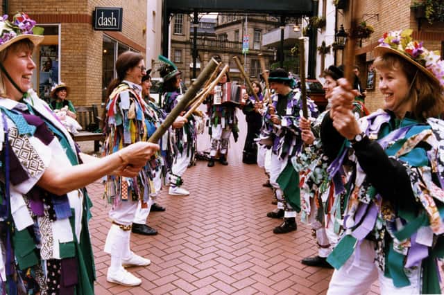 Female Morris dancers performing in Orchard Square during Environment Week, July 1996. Ref no: s29029