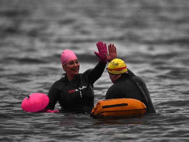 Open water swimming enthusiasts enjoy an early morning swim in Loch Lomond , Trossachs, Scotland. A new study from the UK Dementia Research Institute found that the blood of regular winter swimmers contains a "cold-shock" protein that wasn't found in that of people who did other cold-weather exercise on dry land. This protein has elsewhere been shown to slow the onset of dementia and even repair damage it causes in mice.