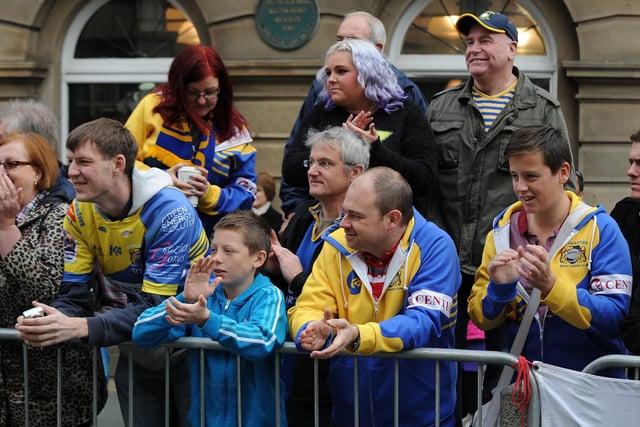 Dons fans enjoy the civic parade to celebrate the club's success.