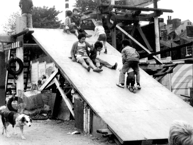 Children having fun at the Pearl Street adventure playground, in Sharrow, Sheffield, during the late 1970s