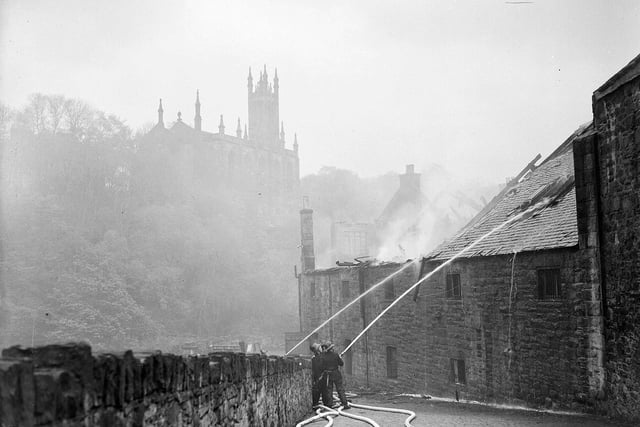 Firemen fight the William Mutrie & Son fire in May 1957.