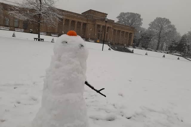 A snowman in Weston Park. Sheffield has seen another major snow fall tonight – but what can we expect today?