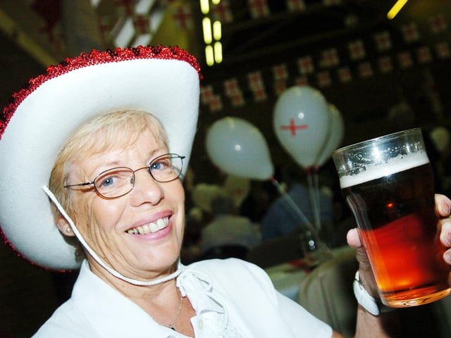 Coun Val Jennings enjoys a pint of real ale at St George's Day celebrations at Armthorpe Community Centre, Doncaster