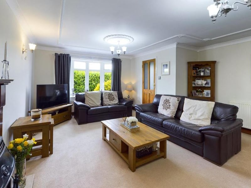 Lounge - uPVC double glazed bow window to the front elevation, ceiling coving, feature fire surround with granite inset and hearth incorporating the outset gas fire, two wall light points, T.V point, two radiator panels and power points.