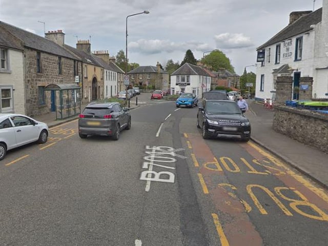 Use layby areas as passenger waiting areas and temporary kerbs in Mid Calder on Bank Street