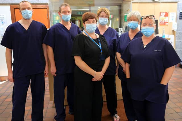 Dr Ben Allen, second left, and staff at Birley Health Centre, pictured earlier this year. Picture: Chris Etchells