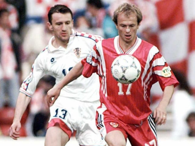 Turkish midfielder Ercan Abudullah(R) blocks Croatian defender Mario Stanic during the Euro 96 match.