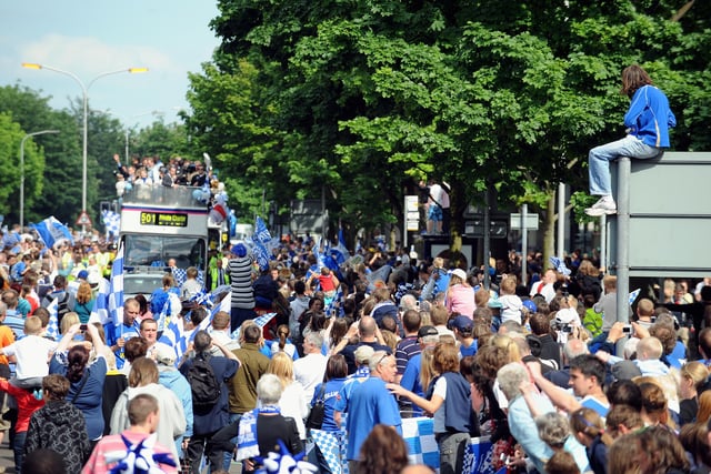 Thousands of Pompey fans line the streets of Portsmouth to watch, Portsmouth Football Club winners of the FA Cup 2008, parade the FA Cup through the streets. Picture: Allan Hutchings 082212-928