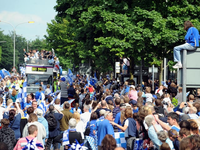 Thousands of Pompey fans line the streets of Portsmouth to watch, Portsmouth Football Club winners of the FA Cup 2008, parade the FA Cup through the streets. Picture: Allan Hutchings 082212-928